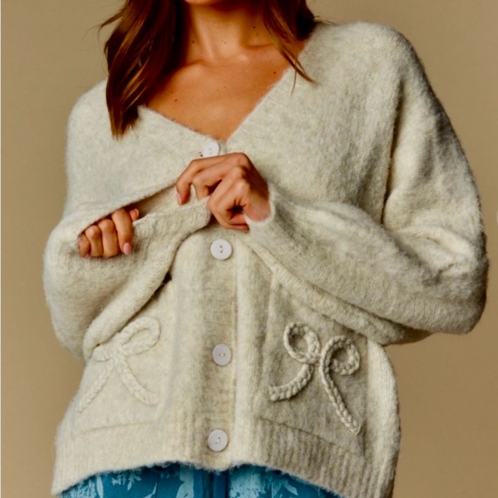 Rareraw Cozy Cream Button-Up Cardigan with Braided Bow Pockets